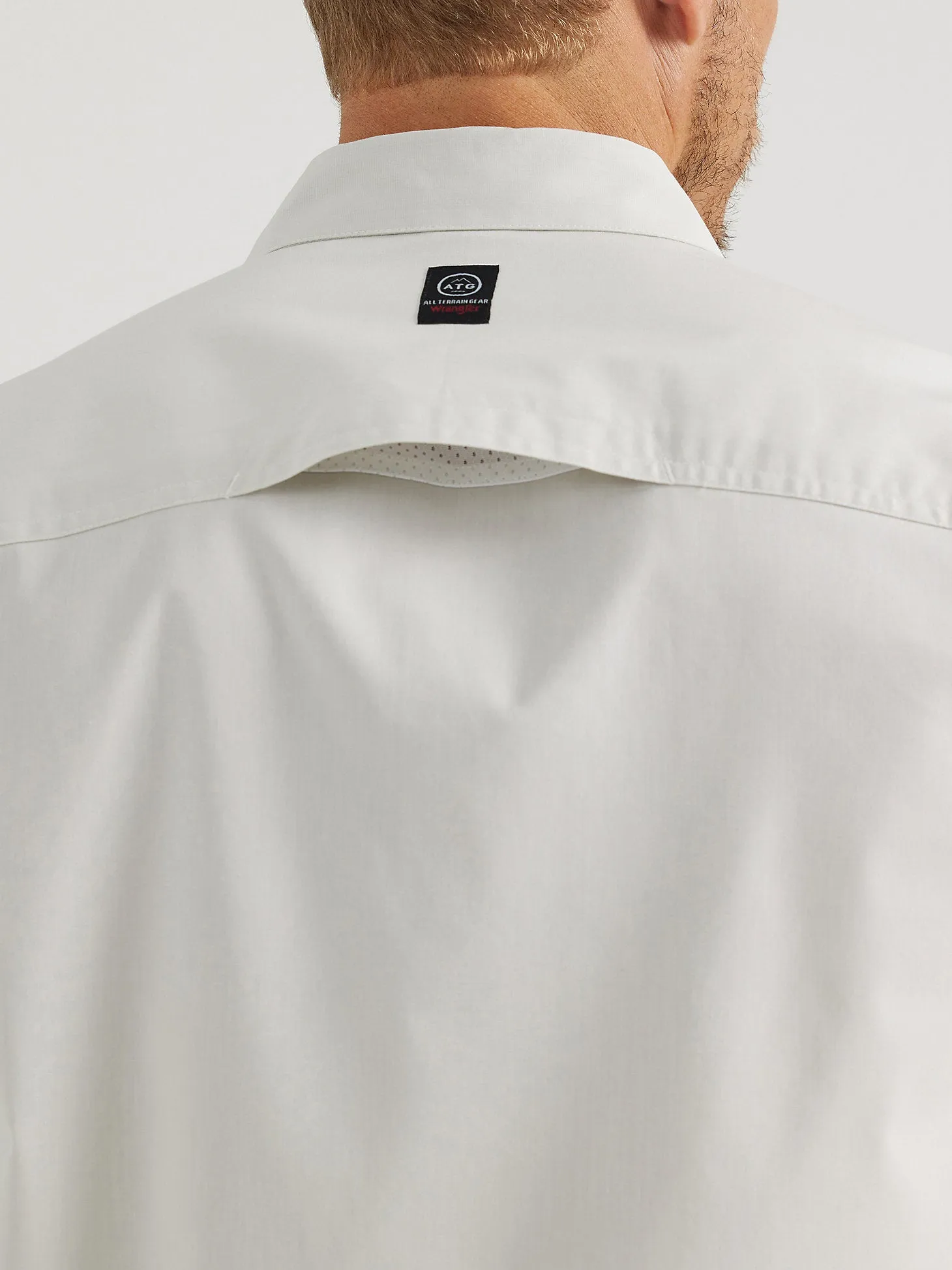 WRANGLER ATG MEN'S ASYMMETRICAL ZIP POCKET SHIRT IN BLUE FOX